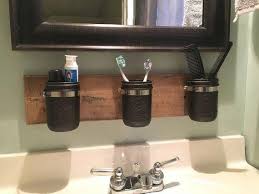 Plus, it keeps the toothbrushes separate for every member of the family. Farmhouse Mason Jar Organizer Rustic Mason Jar Bathroom Bathroomdecorating Mason Jar Bathroom Organizer Mason Jar Bathroom Rustic Bathroom Organizers