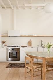 Set of 2 pom pom seat pads. Photo 24 Of 73 In Kitchen Range Hood Open Photos From A Historic Saloon Gains New Life As An Airy Courtyard Home In San Francisco Dwell