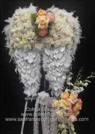 Sympathy flowers for the home. Angel Wings Floral Funeral Tribute