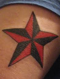 Red nautical star and grey star tattoos on lowerback. Red And Black Star Tattoo Tattooimages Biz