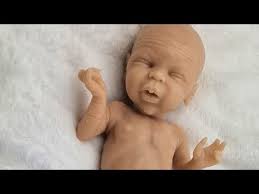 opening a full body silicone baby preemie by Sandra Linke she is available 