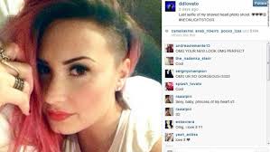 Wearing her short dark hair loose, she could be seen peering over her shoulder and her sunglasses, striking a demi lovato admitted to editing some of her instagram pictures (image: Celebridades Y Famosos Con Pelo Corto