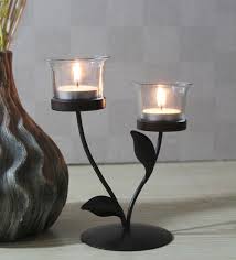 Clear ones communicate a sleek appearance while. Buy Black Metal Table Tea Light Holder By Hosley Online Table Tea Light Holder Festive Lights Lamps And Lighting Pepperfry Product