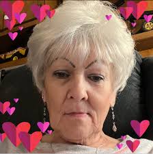 I was at the river, hidden in the reeds, hoping to take photos of wildlife  when I espied a man tenderly carrying his dog into the water and gently  setting her down.