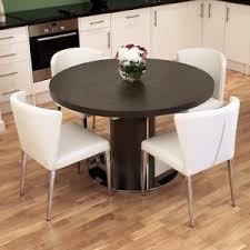 This solid wood dining table from wayfair has a distressed finish and enough room to seat eight people when fully extended. Free Assembly On The Modern Curva Round Extending Dining Tables Danetti