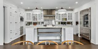 The deep mahogany floors and ceiling dilute the white and ground the. Luxury Kitchen Design Ideas Kitchen Pics Gambrick