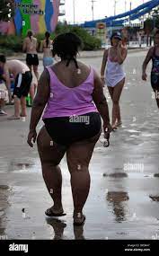 Obese black woman at water park, USA Stock Photo 