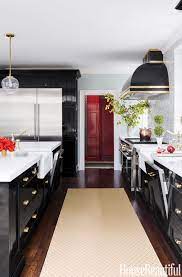 The countertops are glossy gray quartz. 21 Black Kitchen Cabinet Ideas Black Cabinetry And Cupboards