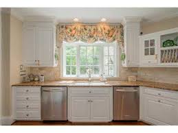 Gathered fabric valance under a wood valance in kitchen. Realtor Com Real Estate Listings Homes For Sale Kitchen Window Coverings Kitchen Sink Window Kitchen Window Valances