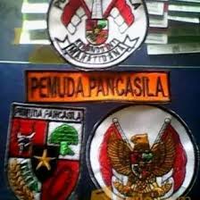 File_download the wall is painted yellow, background. Logo Pemuda Pancasila