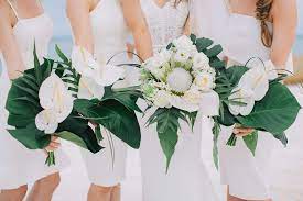 A wedding of simple elegance is made possible with some silver lace flowers as your wedding decor. Katie Andy S Modern Tropical Riviera Maya Wedding Fine Day Press Tropical Wedding Bouquets Tropical Wedding Inspiration Tropical Wedding