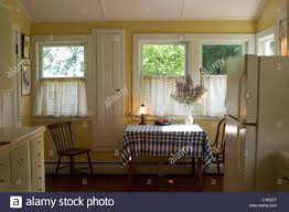 a small country kitchen is bathed in