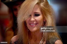 Lita Ford , Guitarist Patrick Kennison and Bass Guitar Motty O'Brien...  News Photo