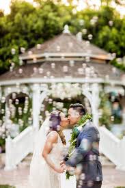 A Kiss Engulfed In Bubbles After Their Ceremony At Rose Court Garden Disney World Wedding Disney Wedding Disneyland Wedding