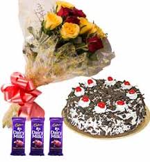 Assorted chocolates with pink roses. Send Order Special Combo Of Flower Cake And Chocolates Online Delivery Indianflowercakengifts Com