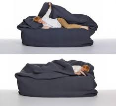 It's no surprise that beanbags are one of today's hottest trends in contemporary design. A Bean Bag Bed With Built In Blanket And Pillow