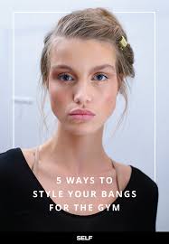 The hair is worn with a braid wrapped around it at the back and pulled into a bun. 5 Creative Ways To Keep Your Bangs Out Of Your Face At The Gym Self