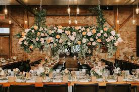 This is the closeup that your guests are going to see for the longest part of the wedding. Hanging Floral Installation Weddingbells