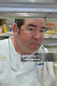 Chef Emeril Lagasse meansgetting poses