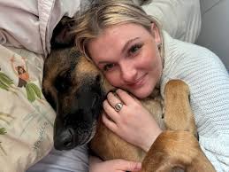 How can I help ease my dog's ear infection pain after a medicated bath?