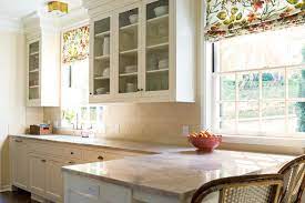 These kitchens use white cabinetry, understated paint colors, exposed brick. A Fresh Kitchen For A 1930s Colonial Revival House