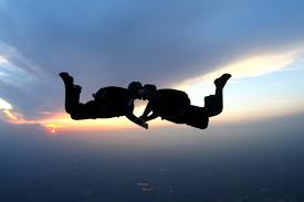 Couple Kissing While Skydiving In The Sunset Radisson Blu Blog