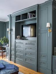 Camille Long Sconces Are Mounted To The Side Of Gray Built In Cabinets Adorned With Glass And Bedroom Built Ins Built In Bedroom Cabinets Rustic Master Bedroom