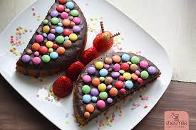 Aus genau diesem grund, möchten wir dir vor dem kauf die informationen zu verfügung stellen, damit du keinen fehlkauf durchführst. Ein Schokokuchen Schmetterling Mit Smarties Und Erdbeeren