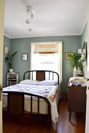 On the wall, we do see a couple of paintings that are shielded by this bedroom features that exposed brick and on that brick are very different pieces of wall art. How To Decorate With Sage Green In Your Home Apartment Therapy
