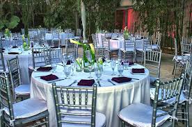 Table Setting With Silver Chiavari Chairs White Satin Linens And White Callalilies Yourmiamiwe Catering Design Event Catering Wedding Decorations Centerpieces
