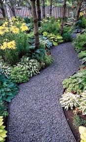 These wood pavers march in pairs to a grassy pathway. Top 60 Best Gravel Landscaping Ideas Pebble Designs