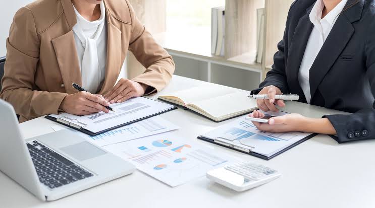 Executive team reviewing forward-looking corporate financial management plan