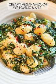 Soft Fluffy Pillows Of Gnocchi Tender Sauteed Kale Tossed In A Creamy Garlic Infused Sauce This Cre Vegan Dinner Recipes Vegan Dinners Whole Food Recipes