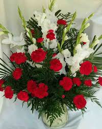 Nine members of carr family gather on steps of carr house for group photo. Florist One Posts Facebook