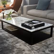 Yes, your coffee table can be higher than your couch. Verona Marble Wood Coffee Table