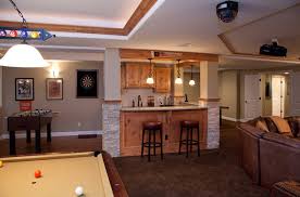 Well, let's talk, affordable finished basement ideas, including painting basement concrete walls, painting the ceiling joists, and acid staining the basement floor is something you can have. Affordable Basement Remodeling Bill Wegner Renovation Consultant