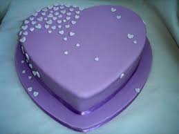 This homemade chocolate cake with vanilla buttercream is decorated with ombre hearts. Pin By Styling With Cheri On Purple Cakes Heart Shaped Cakes Valentine Cake Cupcake Cakes