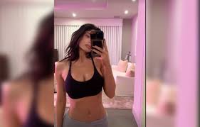 Kylie Jenner Strips Down To Only A Sports Bra In New Selfies