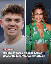 She was all smiles while posing at DeJean's locker after Philadelphia's  31-0 shutout win over the Raiders