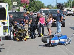 Motorcycle, truck collide