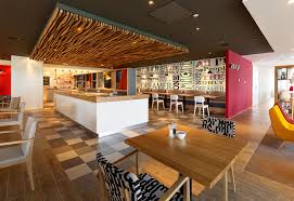 The rooms are comfortable and clean as you would expect, the restaurant serves excellent food, and the bar is stocked with dutch and belgian beers to relax with. Holiday Inn And Holiday Inn Express Amsterdam Arena Towers Mulderblauw Architecten Media Photos And Videos 4 Archello