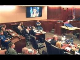 A federal atf officer carries protective gear onsite at the home of the shooting suspect. Colorado Movie Theater Shooter Sentencing Youtube