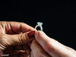 Download Premium Image Of Hand Holding A Wedding Ring 50418 Engagement Rings Couple Wedding Rings Men Diamond Ring