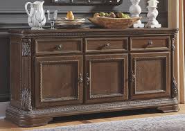 Signature design by ashley charmond dining room buffet, brown visit the signature design by ashley store. Charmond Dining Room Buffet Ashley Furniture Homestore Independently Owned And Operated By Hamad M Al Rugaib Sons Trading Co