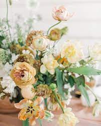 Gorgeous Centerpiece For A Spring Utah Wedding Featuring Ranunculus Tulips Poppies Narcissus Lisi Yellow Wedding Flowers Floral Wedding Flower Centerpieces