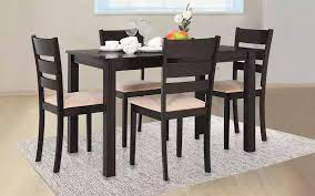 The 4 seater dining table set prices at hometown may vary based on its material, tabletop material, chair pad material, size, and design. Buy Royaloak Berlin Wooden 4 Seater Dining Table S Royaloak