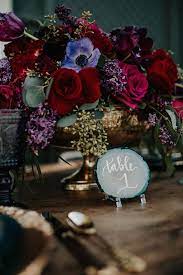 Pairing perfectly with darker flowers and. Modern And Romantic Jewel Toned Inspiration Nearly Newlywed Blog Wedding Blog Purple Wedding Centerpieces Jewel Tone Wedding Wedding Centerpieces