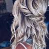 We've gone back to easy and breezy wedding hair here and this look screams bohemian, a super simple and romantic way to wear your hair with, once again, the simple addition of some floral beauties. 1