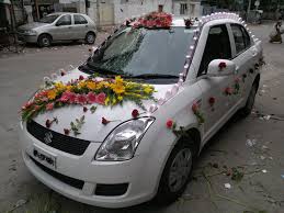Find wedding car decorations to give the newlyweds a proper sendoff: Simple Car Decoration For Wedding With Using Flower Arrangement And Pink Ribbon Car Decor Wedding Car Wedding Car Decorations