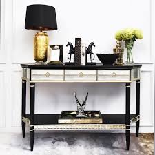 You can make them a feature by adding mirrored. Philippe Black Gold Mirrored Console Table Finn Avenue